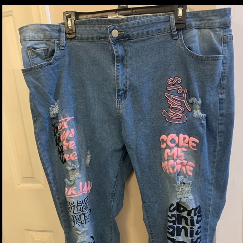 Women’s Ripped Light Blue Long Jeans with Pink and Black Design. Size: 5X-Large.